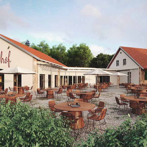 Ein langezogenes Gebäude mit der Aufschrift Restaurant Biergarten Kastanienhof. Dahinter schließt sich ein weiteres langes Haus an. Beide mit beiger Fassade. Im Schotterhof davor ein großer Biergarten mit vielen Sitzgelegenheiten aus Holz umgeben von Grün.